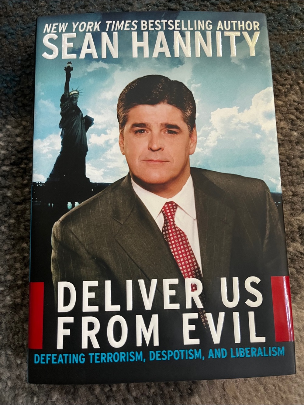 Deliver Us From Evil by Sean Hannity - Black & Blue Hardcover Coffee Table Book